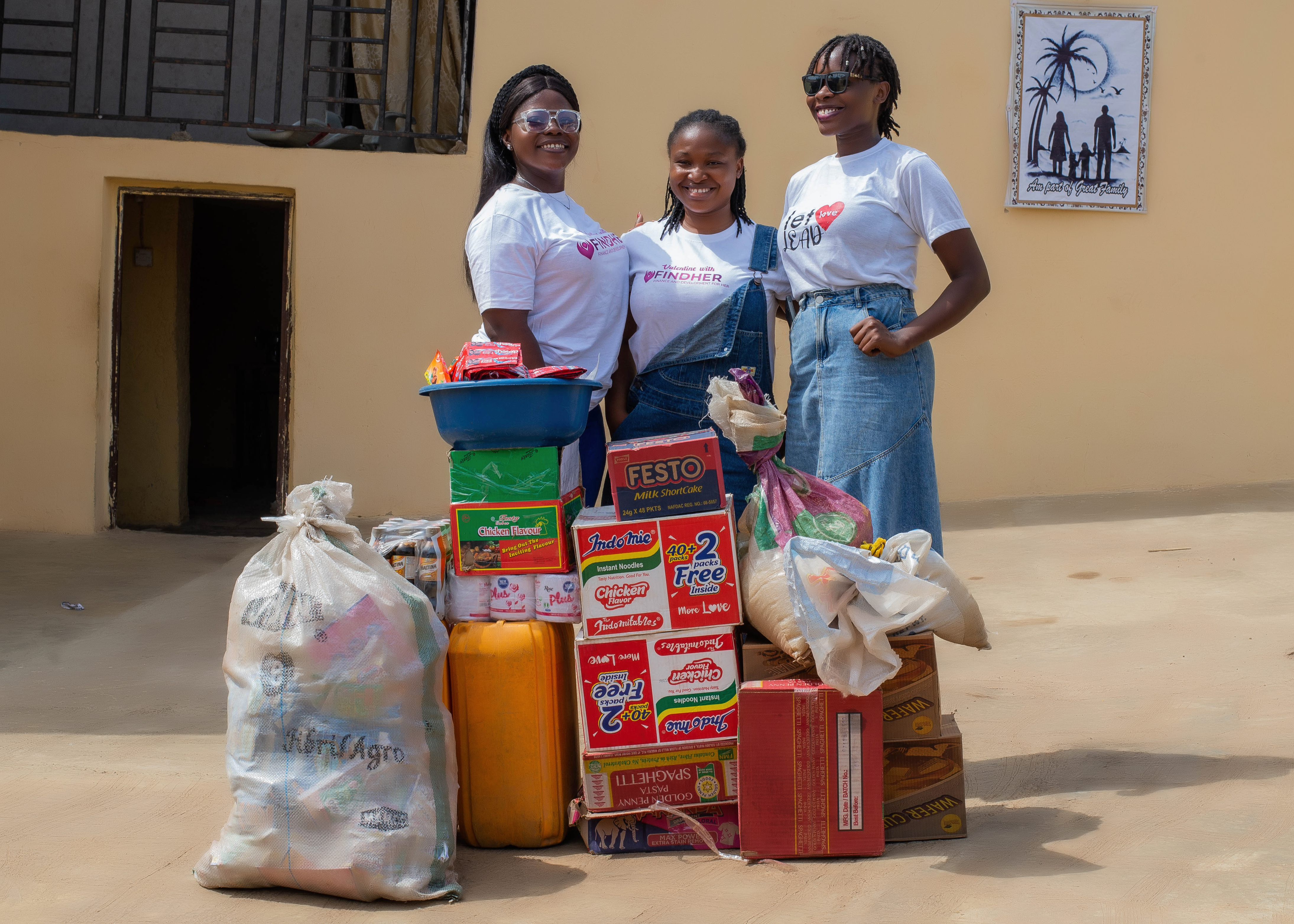 Women receiving supplies from FindHer